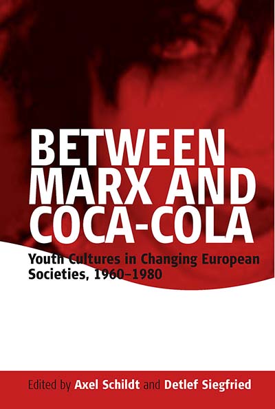 BETWEEN MARX AND COCA-COLA